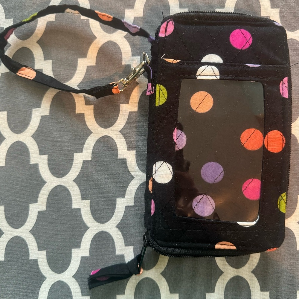 Brand new, colorful, polka dotted wristlet/clutch.